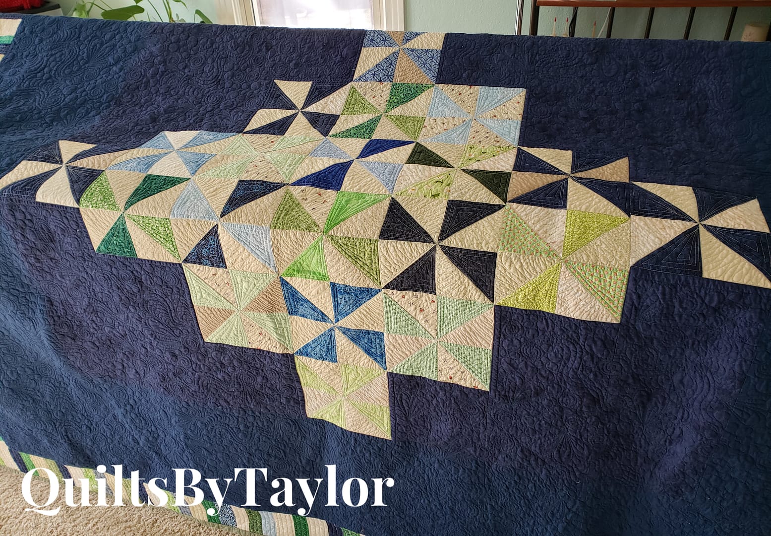 Handmade Pinwheel Quilt with free motion spiral quilting in bright cotton fabrics
