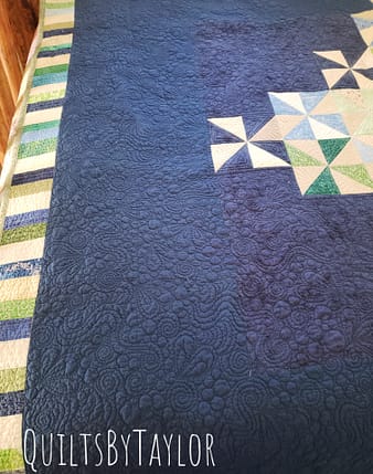 Quilts For Sale Handmade Pinwheel Quilt with free motion spiral quilting in bright cotton fabrics