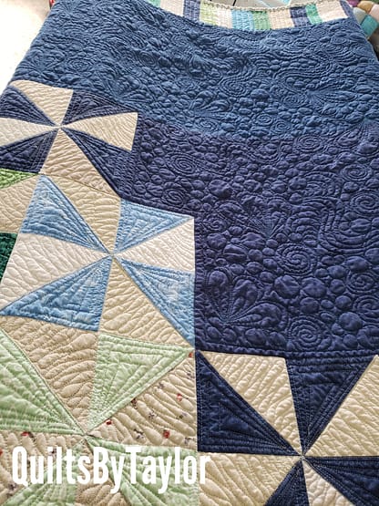 Quilts For Sale/ Quilt for Sale/ Quilt for Sale Handmade Custom Pinwheel Quilt in King size displayed on bed, handmade by Quilts by Taylor